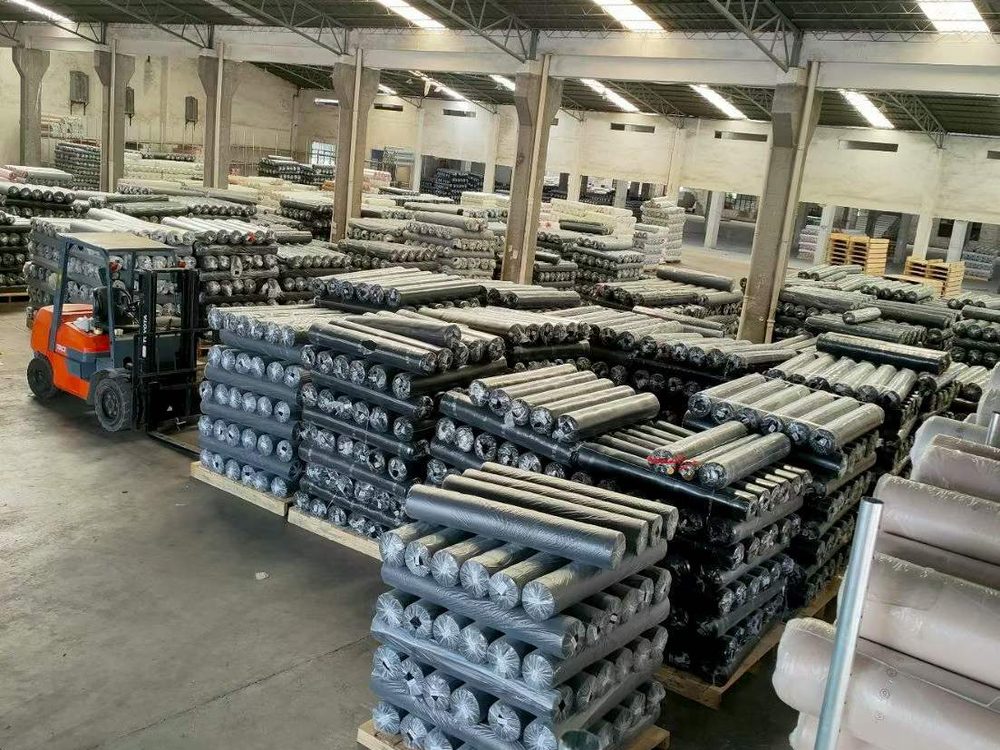 Leather rolls stacked on pallets in the warehouse